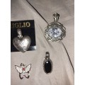 Four assorted ladies pendants including milgo mil