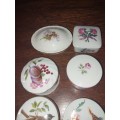 Six assorted small procelain trinket boxes