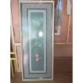 Framed oriental silk tapestry behind