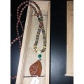 Stunning long beaded necklace with gem stone