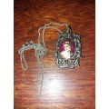 Vintage sliver booking  necklace with portrait pendant