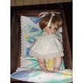 Cute full procelain baby doll in wooden  crib