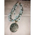 Well made three tear blue beaded necklace