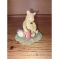 Collectable pooh bear with a honey jar ornament