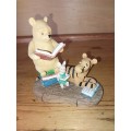Collectable pooh bear reading ornament