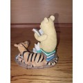 Collectable pooh bear reading ornament