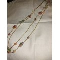 Long gold plated necklace with gem stone