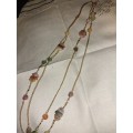 Long gold plated necklace with gem stone