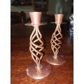 A pair of copper twisted candle holders