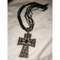 Costume cross pendant on ribbon necklace