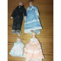Four cute procelain mini family dolls