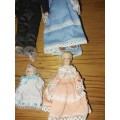Four cute procelain mini family dolls