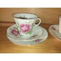 A pair of pretty rose tea cup trios