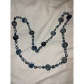 Long blue pearl and beaded necklace