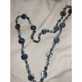 Long blue pearl and beaded necklace