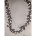 Stunning black pearl necklace
