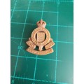 WWII British Royal Army Ordnance Corps plastic economy badge with blades