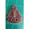 WWII British Royal Army Ordnance Corps plastic economy badge with blades