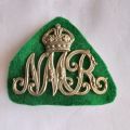 Natal Mounted Rifles Helmet badge with green backing, worn 1922 - 1943