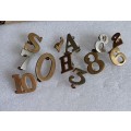 Selection of 12 brass & WM numbers and letters