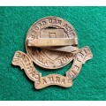 South African Red Cross Society cap badge with blades.