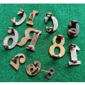 Selection of 11 Military brass & WM numbers and letters inc 8th Army medal adornment