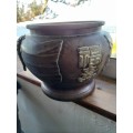 A HEAVY METAL POT WITH CHINESE CHARACTERS