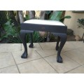Black and white ball and claw piano seat