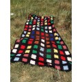Black with coloured blocks long crochet blanket