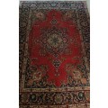 A Persian Hand Knotted Tabriz Carpet