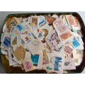 CHOCOLATE TIN FULL OF STAMPS ON PAPER - MIXED WORLD