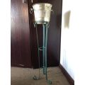 ICE BUCKET ON PAINTED WRAUGHT IRON STAND-THE BUCKET IS PLATED SILVER WITH A DIAMETER OF 24 CM AT THE