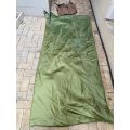 MILITARY ISSUE SLEEPING BAG-LOOKS LIKE PARACHUTE MATERIAL,WITH VELCRO ON THE ONE SIDE-COMES WITH CO