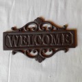 Cast Iron `WECOME` sign.