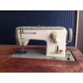 Bernina Model 740 Sewing Machine with cabinet and accessories , good condition, recently serviced