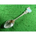 Souvenir spoon as per pictures silver plated with plating wear at the back front is perfect
