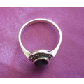 A SOLID SILVER MARCASITE RING WITH A BLACK STONE--NEW
