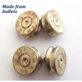A cufflink box with cufflinks including a trench art pair made from bullets