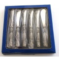 A SET OF SIX BUTTER KNIVES IN ORIGINAL UNOPENED PACKAGING