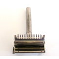 AN AUTO  STROP SAFETY RAZOR WITH BLADES AND A HAIR CUTTER