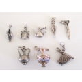 A LOT OF SOLID SILVER CHARMS---23,6 Gram