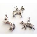 A LOT OF SOLID SILVER CHARMS--- 21,6 Gram
