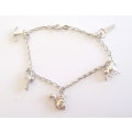 A SOLID SILVER CHARM BRACELET