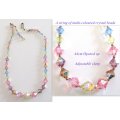 A VINTAGE 1 STRING MULTI-COLOURED CRYSTAL NECKLACE WITH A STERLING SILVER CLASP--READ