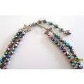 A VINTAGE 2 STRING MULTI-COLOURED CRYSTAL BEADED NECKLACE