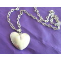 A 72cm LONG STERLING SILVER CHAIN WITH A STERLING SILVER HEART PENDANT