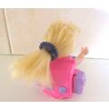 A VINTAGE 1997 BACKPACK DOLL WITH BACKPACK DRESSING TABLE AND ACCESSORIES