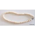 A STRING OF FRESH WATER PEARLS--45cm