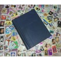 UNUSED  STAMP ALBUM - LOTS OF THEMED STAMPS - DECENT LOT