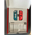 Nintendo switch with games and pouch